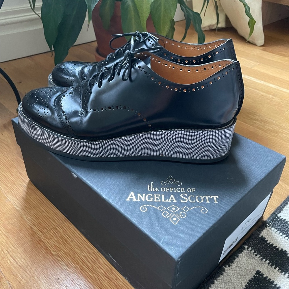 Office of Angela Scott black lace up platform shoes.
